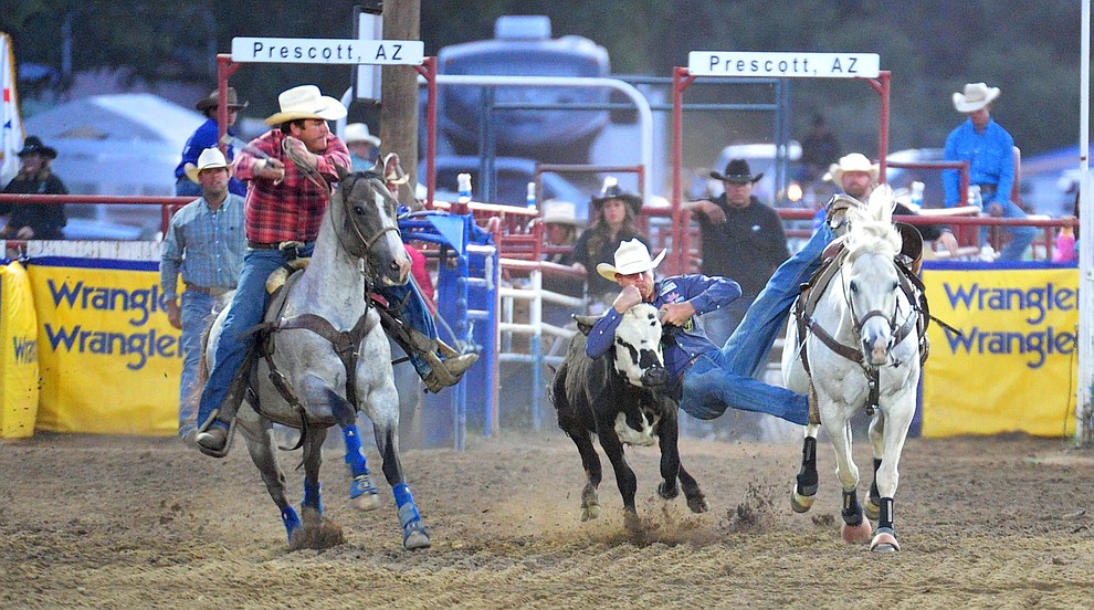 Blake Mindemann has a 4.6 second run in the steer wrestling during the 5th performance of the Prescott Frontier Days Rodeo at the Prescott Rodeo grounds Friday July 5, 2019. (Les Stukenberg/Courier)