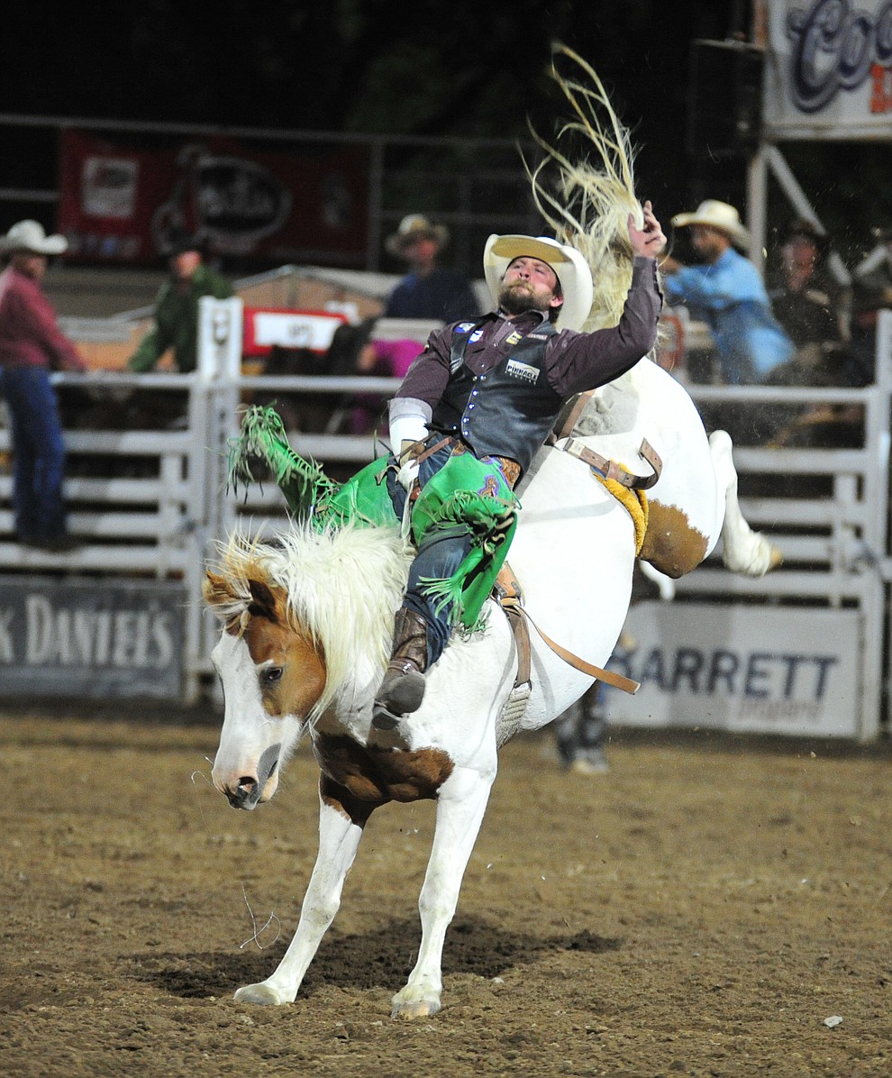 Grant Denny rides Little Linda in the bareback riding during the 5th performance of the Prescott Frontier Days Rodeo at the Prescott Rodeo grounds Friday July 5, 2019. (Les Stukenberg/Courier)