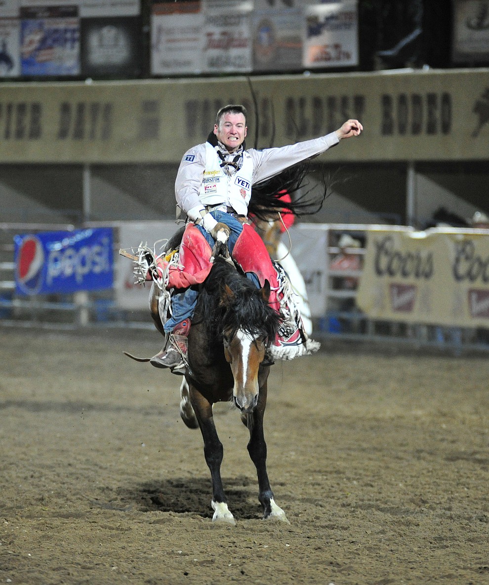 Steven Peebles rides Wrangler Valley in the bareback riding during the 5th performance of the Prescott Frontier Days Rodeo at the Prescott Rodeo grounds Friday July 5, 2019. (Les Stukenberg/Courier)