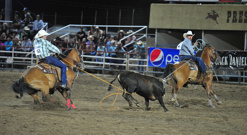 Paden Bray and Erich Rogers have a 7.2 second run in the team roping during the 5th performance of the Prescott Frontier Days Rodeo at the Prescott Rodeo grounds Friday July 5, 2019. (Les Stukenberg/Courier)