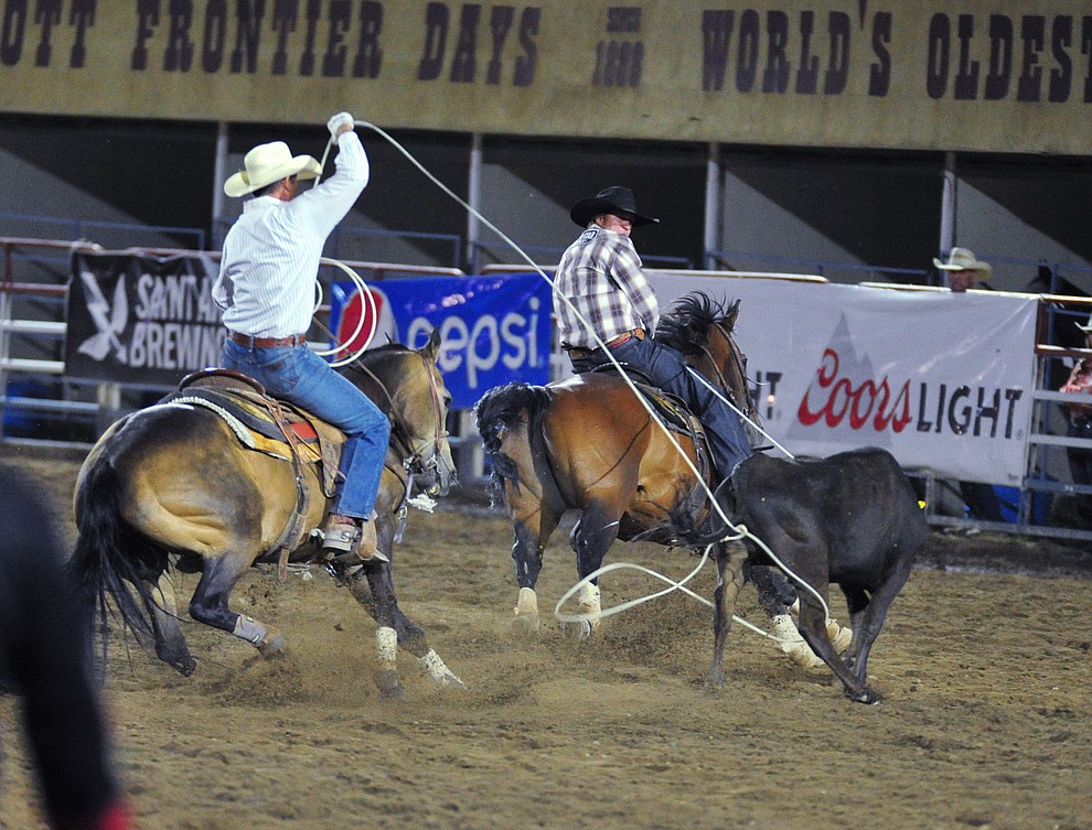 Trey Blackmore and Seth Hall have a 7.6 second run in the team roping during the 5th performance of the Prescott Frontier Days Rodeo at the Prescott Rodeo grounds Friday July 5, 2019. (Les Stukenberg/Courier)