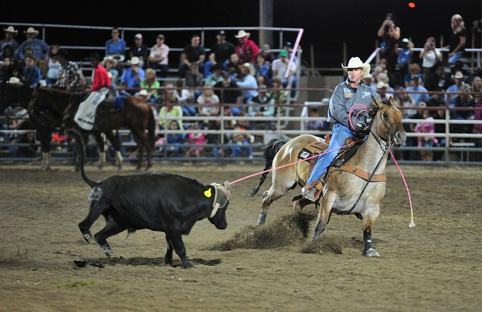 Matt Sherwood and his partner Hunter Koch, not pictured, have a 7.3 second run in the team roping during the 5th performance of the Prescott Frontier Days Rodeo at the Prescott Rodeo grounds Friday July 5, 2019. (Les Stukenberg/Courier)