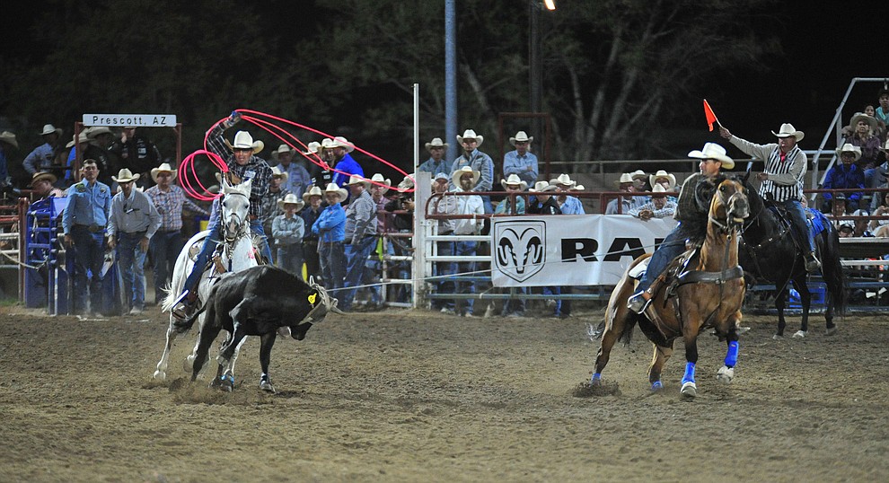 Lee Kiehne and Kirt Jones have a 7.2 second run in the team roping during the 5th performance of the Prescott Frontier Days Rodeo at the Prescott Rodeo grounds Friday July 5, 2019. (Les Stukenberg/Courier)