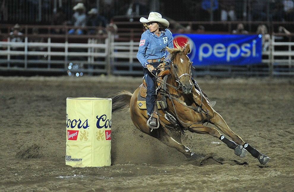 Sarah Kieckhefer runs a fast 17.70 run in the barrel race during the 5th performance of the Prescott Frontier Days Rodeo Prescott Friday July 5, 2019. (Les Stukenberg/Courier)