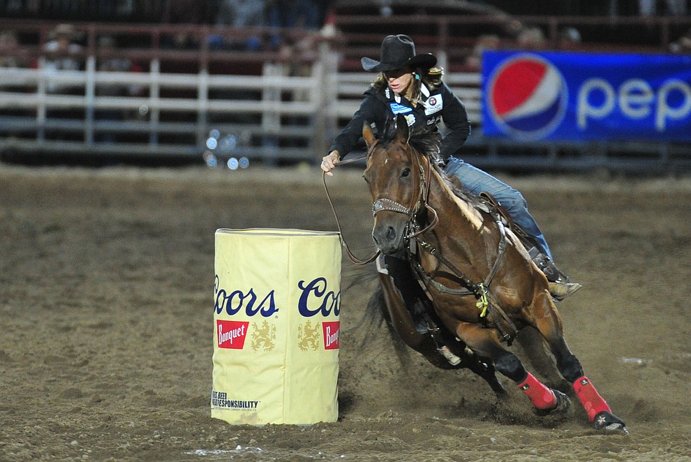Lori Todd takes the lead in the barrel race with this 17.45 second run during the 5th performance of the Prescott Frontier Days Rodeo at the Prescott Rodeo grounds Friday July 5, 2019. (Les Stukenberg/Courier)