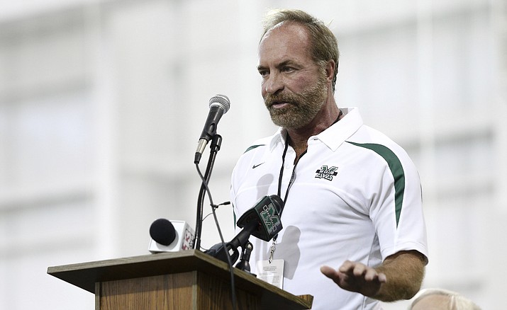 Chris Cline speaks as Marshall University dedicates the new indoor practice facility as the Chris Cline Athletic Complex on Sept. 6, 2014, in Huntington, W.Va. (Sholten Singer/The Herald-Dispatch via AP)
