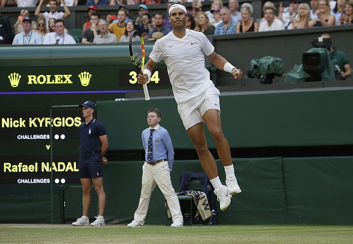 Spain’s Rafael Nadal celebrates after beating Australia’s Nick Kyrgios in a men’s singles match during day four of Wimbledon on Thursday, July 4, 2019, in London. (Kirsty Wigglesworth/AP)