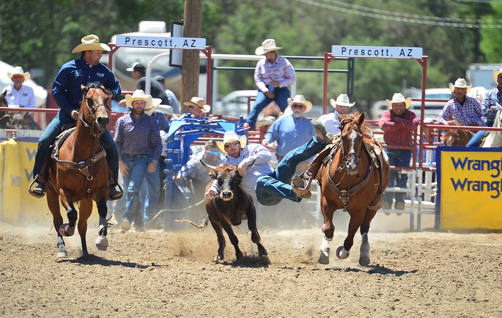Jake Stocking in the steer wrestling during the 6th performance of the Prescott Frontier Days Rodeo Saturday afternoon July 6, 2019. (Les Stukenberg/Courier)