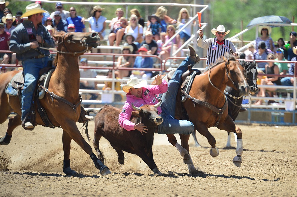 Tanner Brunner in the steer wrestling during the 6th performance of the Prescott Frontier Days Rodeo Saturday afternoon July 6, 2019. (Les Stukenberg/Courier)