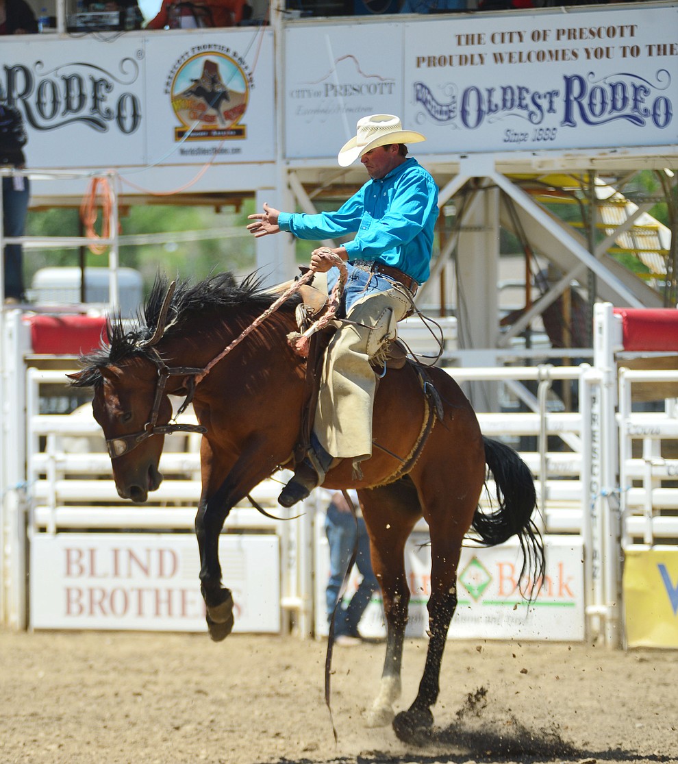 Brett Behrends scores 74 on Kevin's Pride in the Cowpunchers Bronc Riding during the 6th performance of the Prescott Frontier Days Rodeo Saturday afternoon July 6, 2019. (Les Stukenberg/Courier)