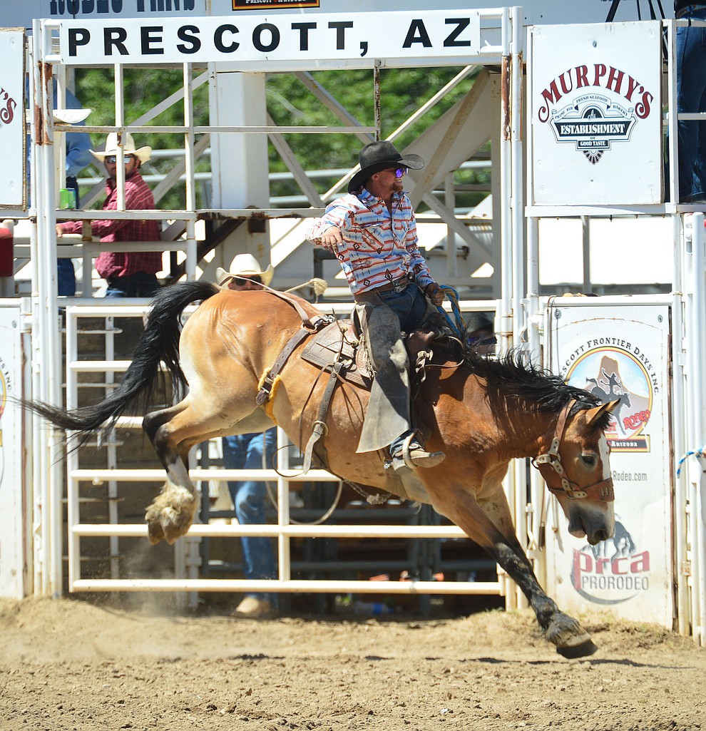 Chase Pope score 64 on Gun Shy in the Cowpunchers Bronc Riding during the 6th performance of the Prescott Frontier Days Rodeo Saturday afternoon July 6, 2019. (Les Stukenberg/Courier)