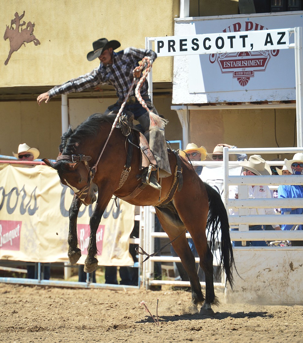 Cody Tillery on Juniper in the Cowpunchers Bronc Riding during the 6th performance of the Prescott Frontier Days Rodeo Saturday afternoon July 6, 2019. (Les Stukenberg/Courier)