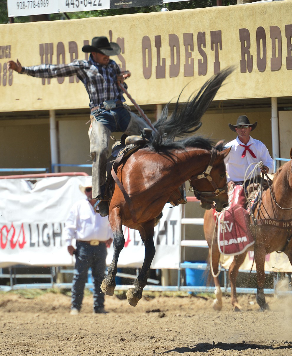Cody Tillery on Juniper in the Cowpunchers Bronc Riding during the 6th performance of the Prescott Frontier Days Rodeo Saturday afternoon July 6, 2019. (Les Stukenberg/Courier)