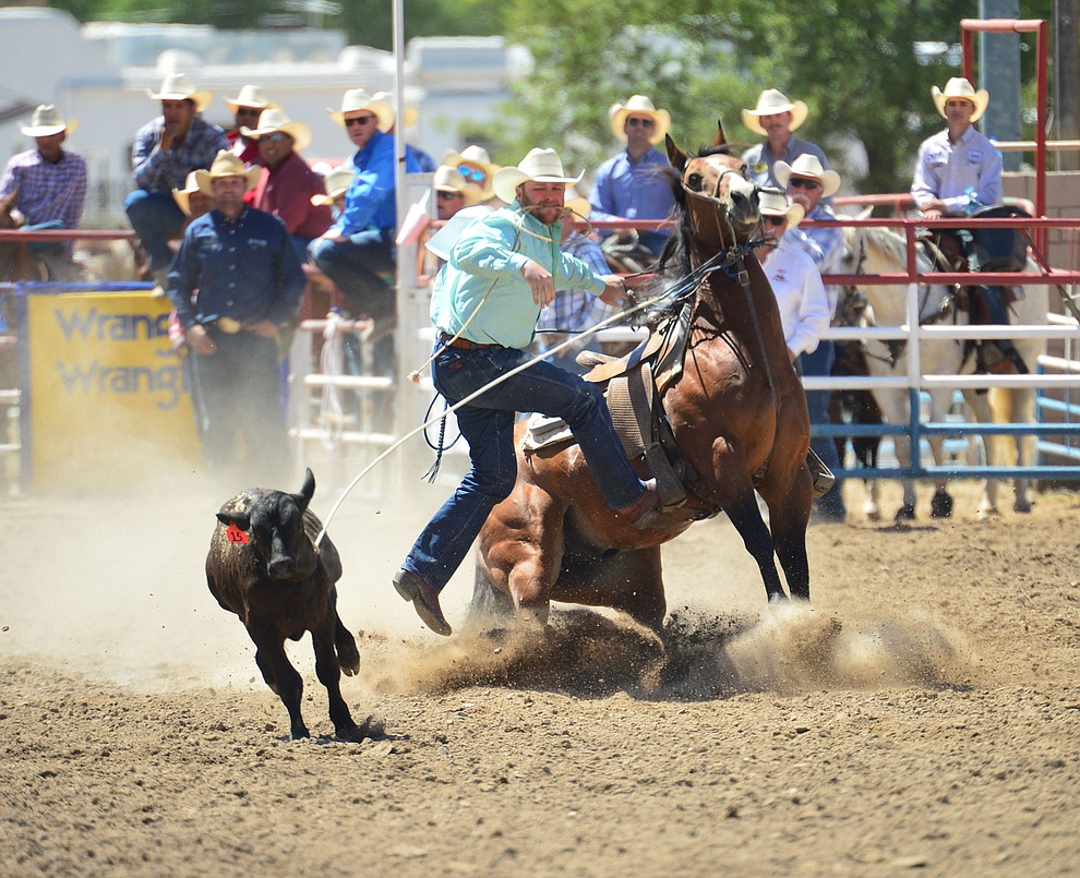 Blake Ash runs 10.4 seconds in the tie down roping during the 6th performance of the Prescott Frontier Days Rodeo Saturday afternoon July 6, 2019. (Les Stukenberg/Courier)