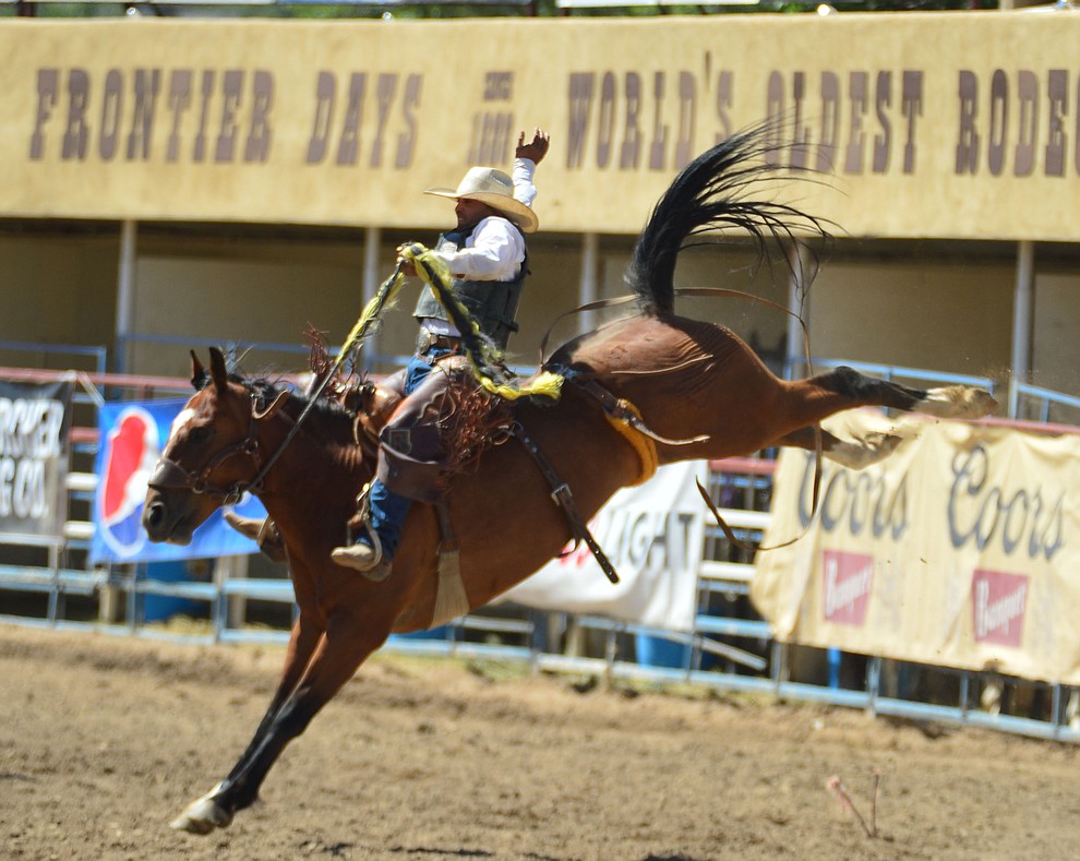 Joaquin Real scores 75 on Music Man in the saddle bronc riding during the 6th performance of the Prescott Frontier Days Rodeo Saturday afternoon July 6, 2019. (Les Stukenberg/Courier)