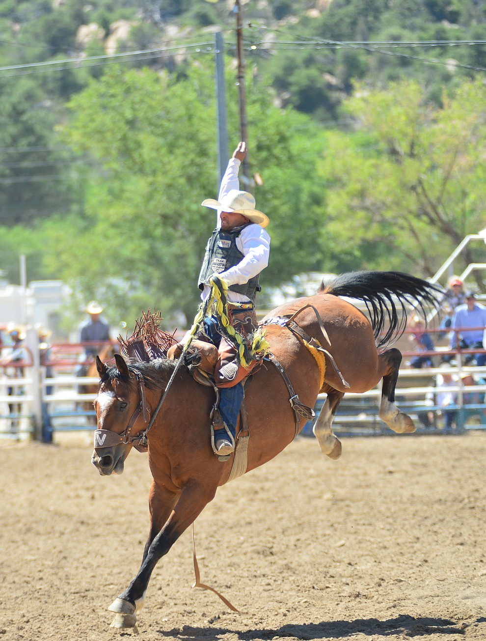 Joaquin Real scores 75 on Music Man in the saddle bronc riding during the 6th performance of the Prescott Frontier Days Rodeo Saturday afternoon July 6, 2019. (Les Stukenberg/Courier)