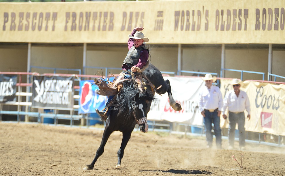 Trent Burd scores 78.5 on Mountain Climber in the saddle bronc riding during the 6th performance of the Prescott Frontier Days Rodeo Saturday afternoon July 6, 2019. (Les Stukenberg/Courier)
