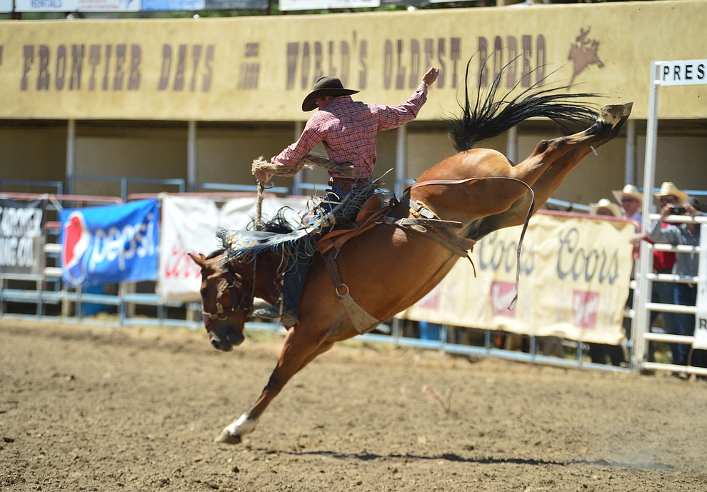 Jake Finlay scores 79 on Big Trick in the saddle bronc riding during the 6th performance of the Prescott Frontier Days Rodeo Saturday afternoon July 6, 2019. (Les Stukenberg/Courier)