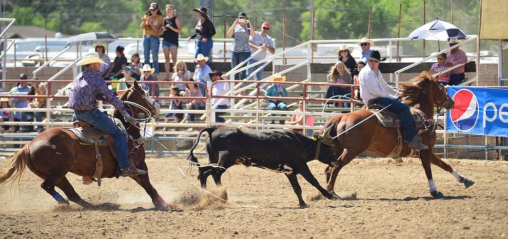 Corey Winnery and Robert Murphy have a 7.2 second run in the team roping during the 6th performance of the Prescott Frontier Days Rodeo Saturday afternoon July 6, 2019. (Les Stukenberg/Courier)