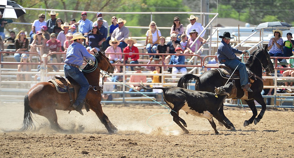 Travis Whitlow and Tanner Luttrell in the team roping during the 6th performance of the Prescott Frontier Days Rodeo Saturday afternoon July 6, 2019. (Les Stukenberg/Courier)