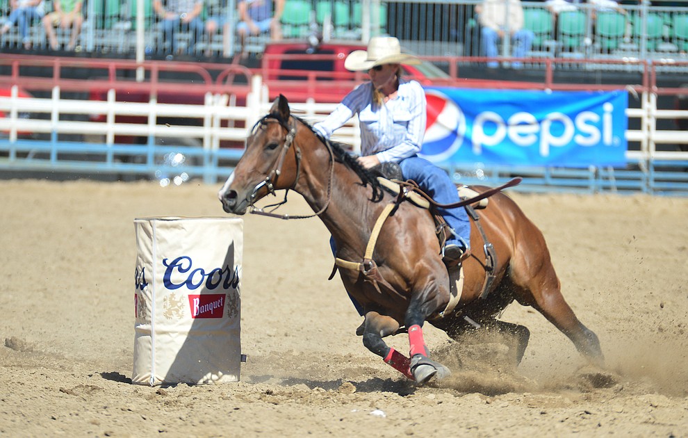 Nicole DeMers runs 17.89 seconds in the barrel race during the 6th performance of the Prescott Frontier Days Rodeo Saturday afternoon July 6, 2019. (Les Stukenberg/Courier)