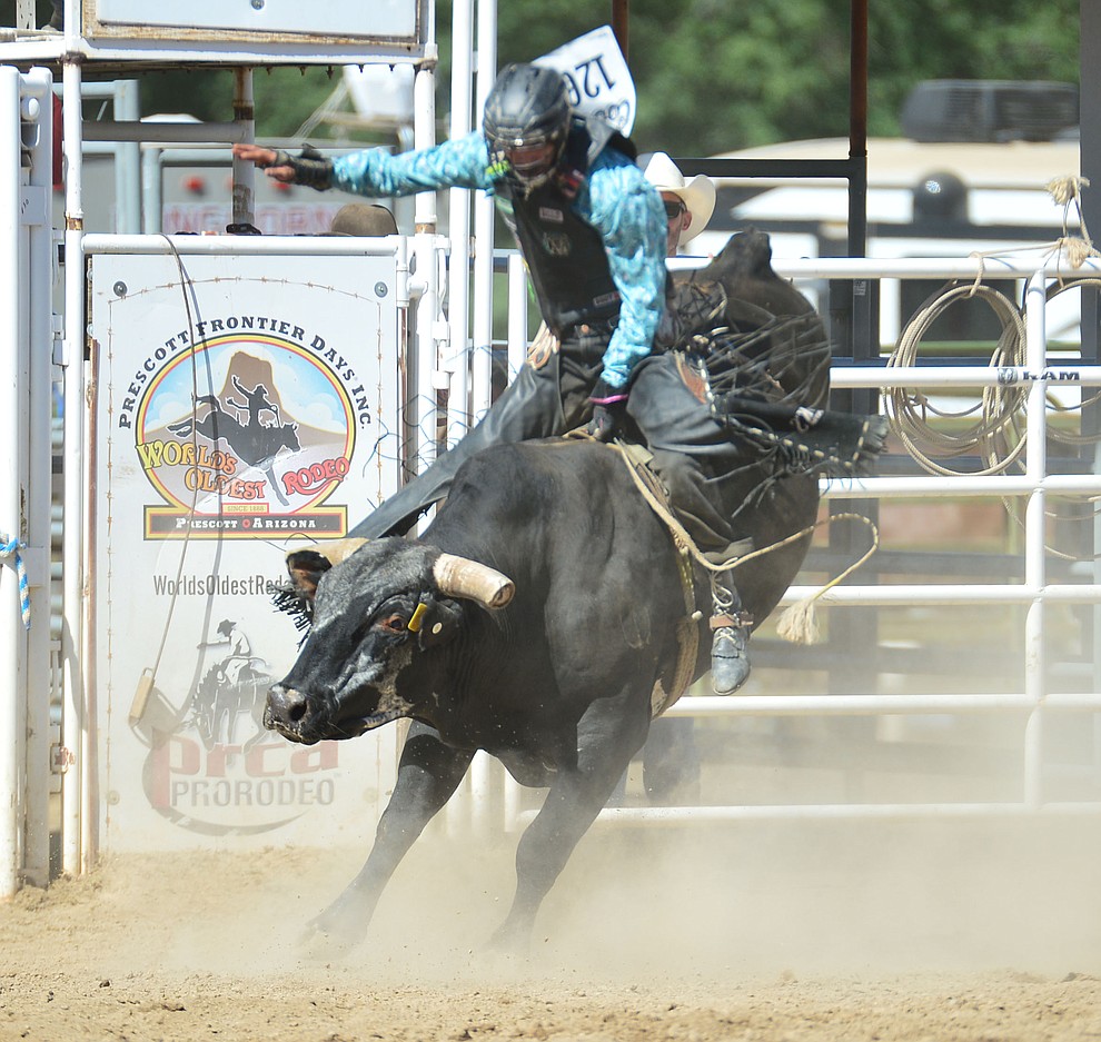 Colby Delmo on Rustler's Roost in the bull riding during the 6th performance of the Prescott Frontier Days Rodeo Saturday afternoon July 6, 2019. (Les Stukenberg/Courier)