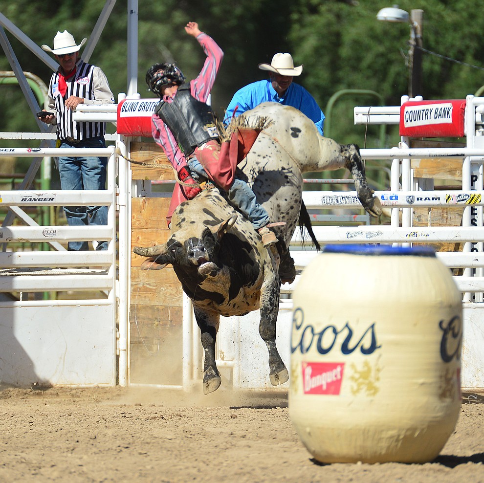 Justin Rickard on Wasted Days in the bull riding during the 6th performance of the Prescott Frontier Days Rodeo Saturday afternoon July 6, 2019. (Les Stukenberg/Courier)