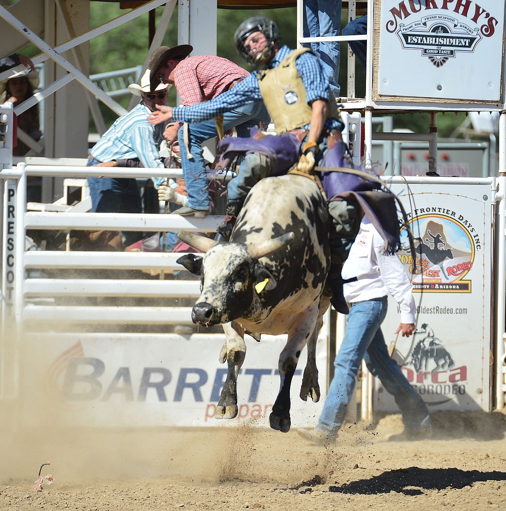 Denton Fugate on Nitro Fusion in the bull riding during the 6th performance of the Prescott Frontier Days Rodeo Saturday afternoon July 6, 2019. (Les Stukenberg/Courier)