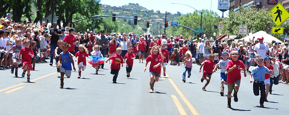 Four to five year olds race during the 37th annual Whiskey Row Boot Race on Montezuma Street in Prescott Saturday July 6, 2019. (Les Stukenberg/Courier)