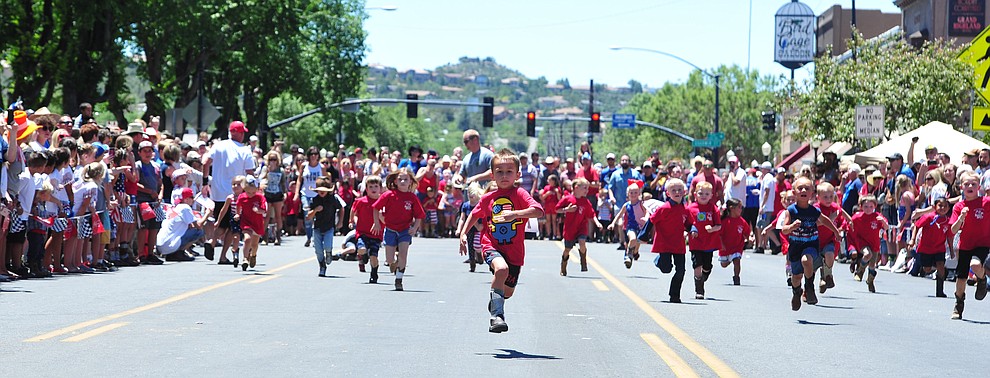 Four to five year olds race during the 37th annual Whiskey Row Boot Race on Montezuma Street in Prescott Saturday July 6, 2019. (Les Stukenberg/Courier)