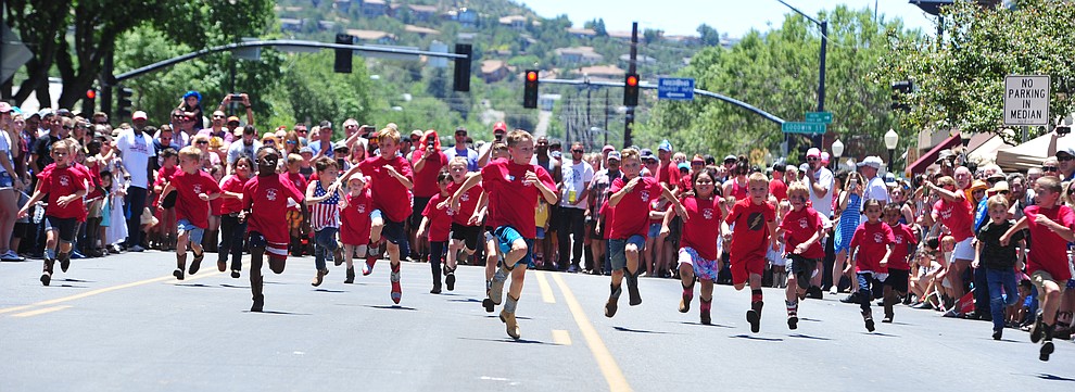 Six to eight year olds race during the 37th annual Whiskey Row Boot Race on Montezuma Street in Prescott Saturday July 6, 2019. (Les Stukenberg/Courier)