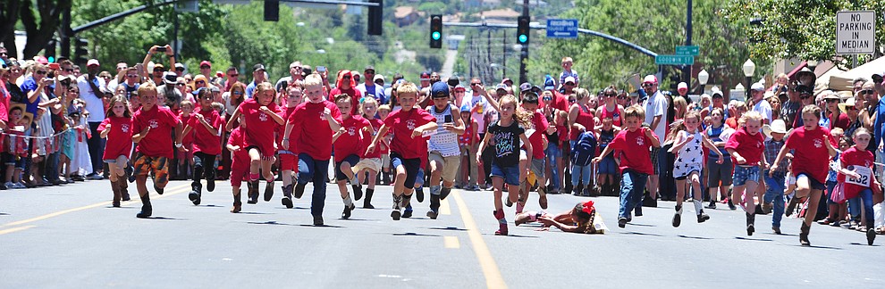 Six to eight year olds race during the 37th annual Whiskey Row Boot Race on Montezuma Street in Prescott Saturday July 6, 2019. (Les Stukenberg/Courier)