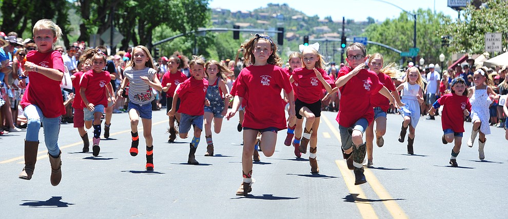 Six to eight year olds race during the 37th annual Whiskey Row Boot Race on Montezuma Street in Prescott Saturday July 6, 2019. (Les Stukenberg/Courier)