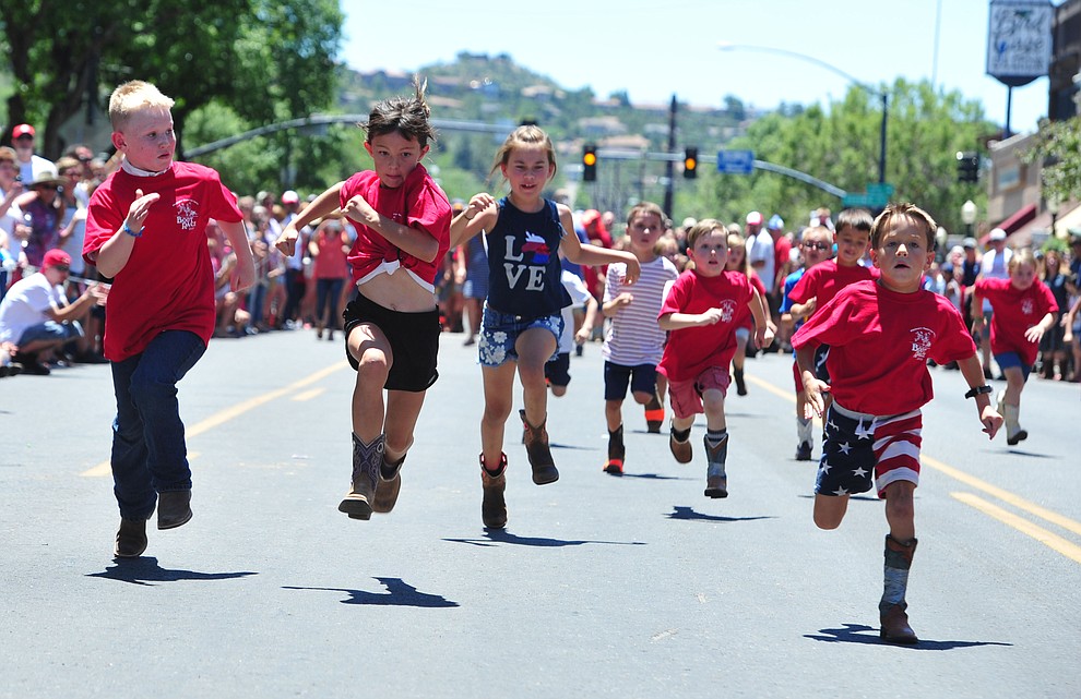 Six to eight year olds race during the 37th annual Whiskey Row Boot Race on Montezuma Street in Prescott Saturday July 6, 2019. (Les Stukenberg/Courier)