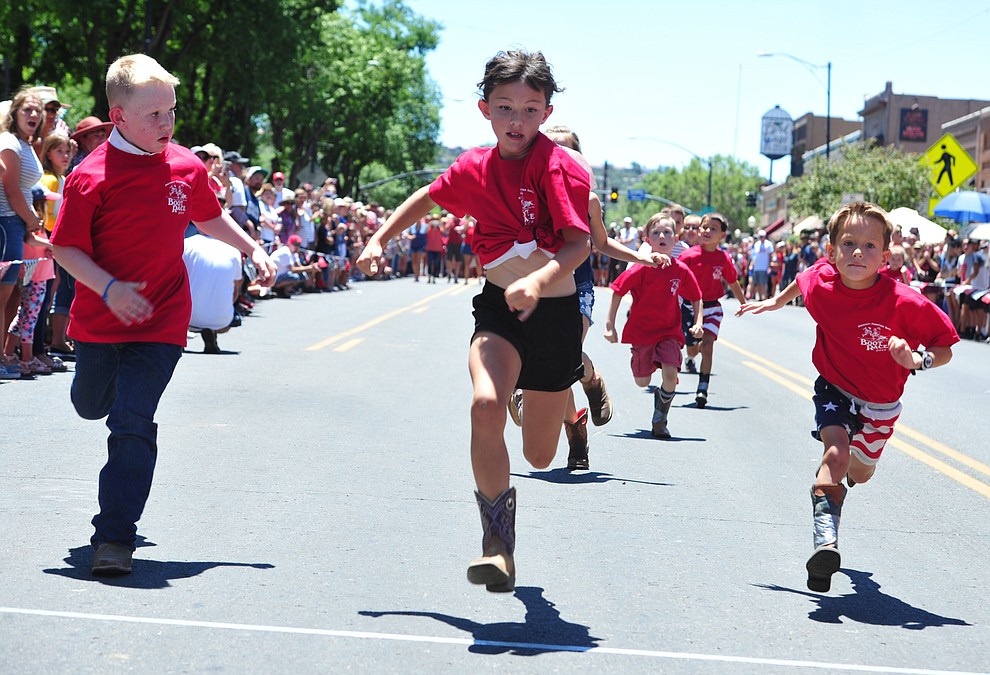 Six to eight year olds race during the 37th annual Whiskey Row Boot Race on Montezuma Street in Prescott Saturday July 6, 2019. (Les Stukenberg/Courier)