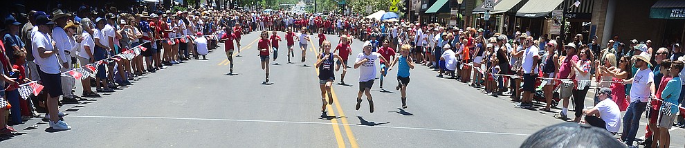 Nine to eleven year olds race during the 37th annual Whiskey Row Boot Race on Montezuma Street in Prescott Saturday July 6, 2019. (Les Stukenberg/Courier)