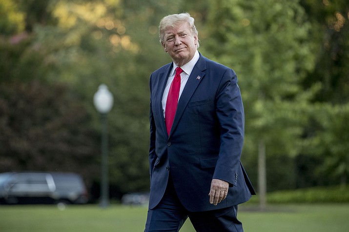 President Donald Trump walks across the South Lawn as he arrives Sunday, June 30, 2019, at the White House. Trump is accusing China and Europe of playing a big currency manipulation game. He says the United States should match that effort, a move that directly contradicts official U.S. policy not to manipulate the dollar’s value to gain trade advantages. (Andrew Harnik/AP, file)