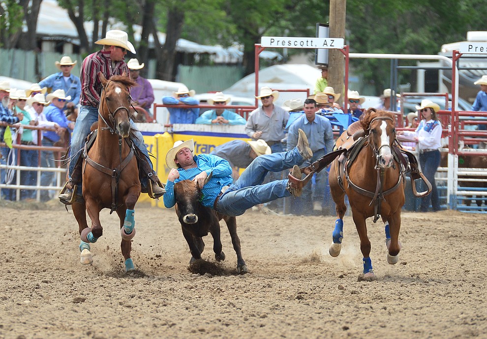 Walt Arnold in the steer wrestling during the final performance of the Prescott Frontier Days Rodeo Sunday July 7, 2019. (Les Stukenberg/Courier)