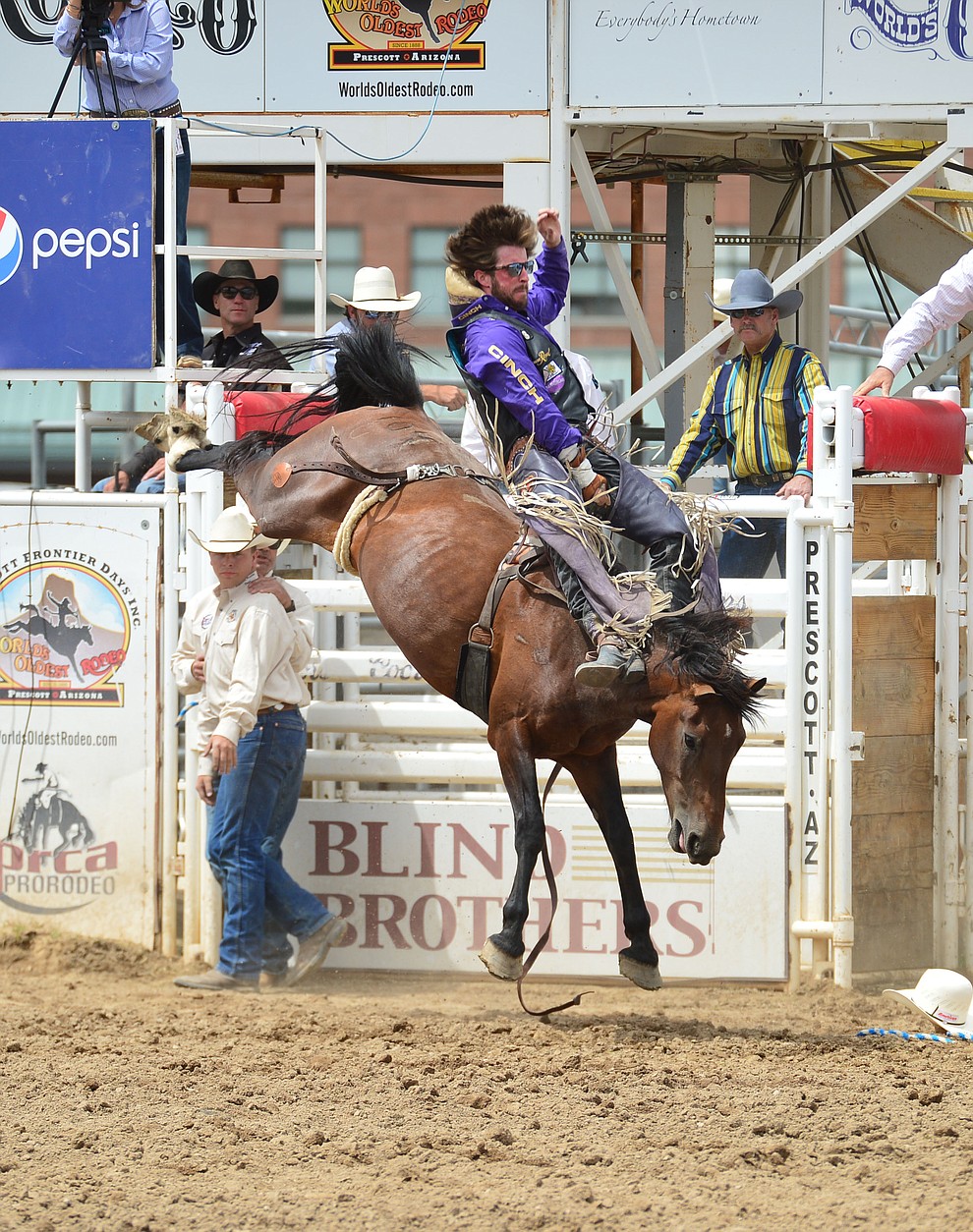 Tilden Hooper rides Jungle Cat for 86.5 points in the bareback riding during the final performance of the Prescott Frontier Days Rodeo Sunday July 7, 2019. (Les Stukenberg/Courier)