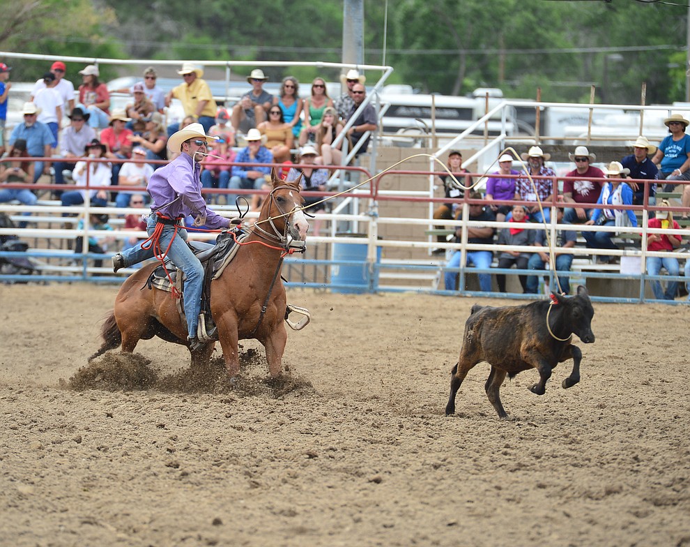 Treg Schaak has a 10.4 second run in the tie down roping during the final performance of the Prescott Frontier Days Rodeo Sunday July 7, 2019. (Les Stukenberg/Courier)