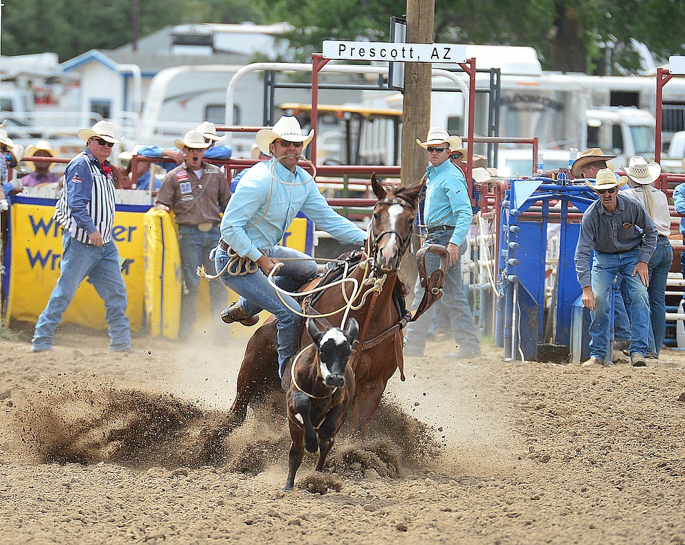 Monty Lewis has a 10.3 second run in the tie down roping during the final performance of the Prescott Frontier Days Rodeo Sunday July 7, 2019. (Les Stukenberg/Courier)