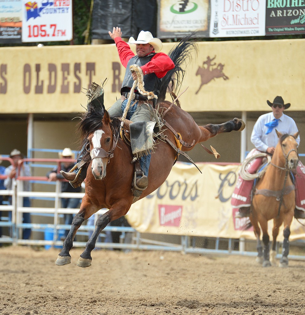 Jesse Bail on Moon Valley in the saddle bronc riding during the final performance of the Prescott Frontier Days Rodeo Sunday July 7, 2019. (Les Stukenberg/Courier)