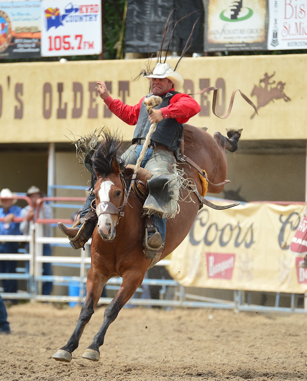 Jesse Bail on Moon Valley in the saddle bronc riding during the final performance of the Prescott Frontier Days Rodeo Sunday July 7, 2019. (Les Stukenberg/Courier)