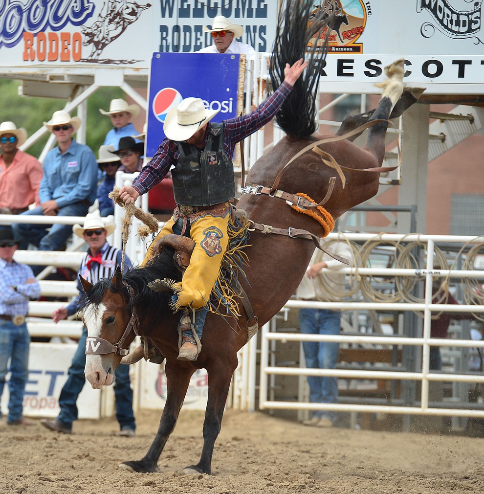 Dean Wadsworth scores 82 on Sky Fall in the saddle bronc riding during the final performance of the Prescott Frontier Days Rodeo Sunday July 7, 2019. (Les Stukenberg/Courier)