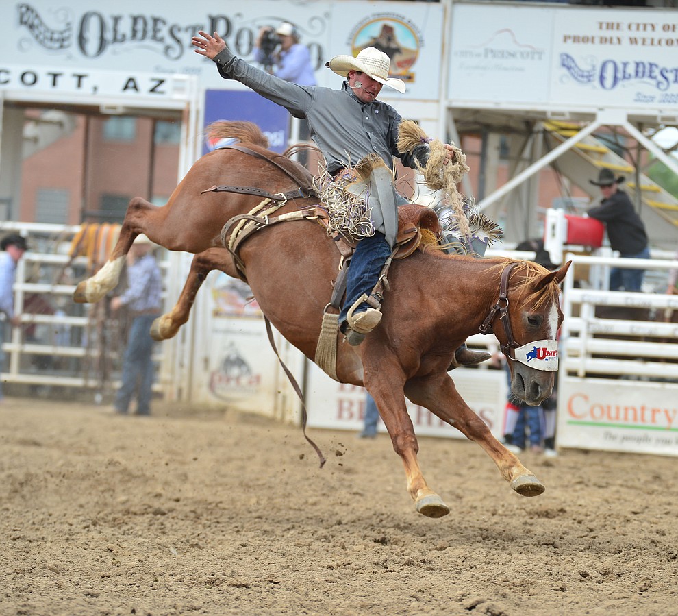 Shorty Garrett scores 77 on Red One in the saddle bronc riding during the final performance of the Prescott Frontier Days Rodeo Sunday July 7, 2019. (Les Stukenberg/Courier)