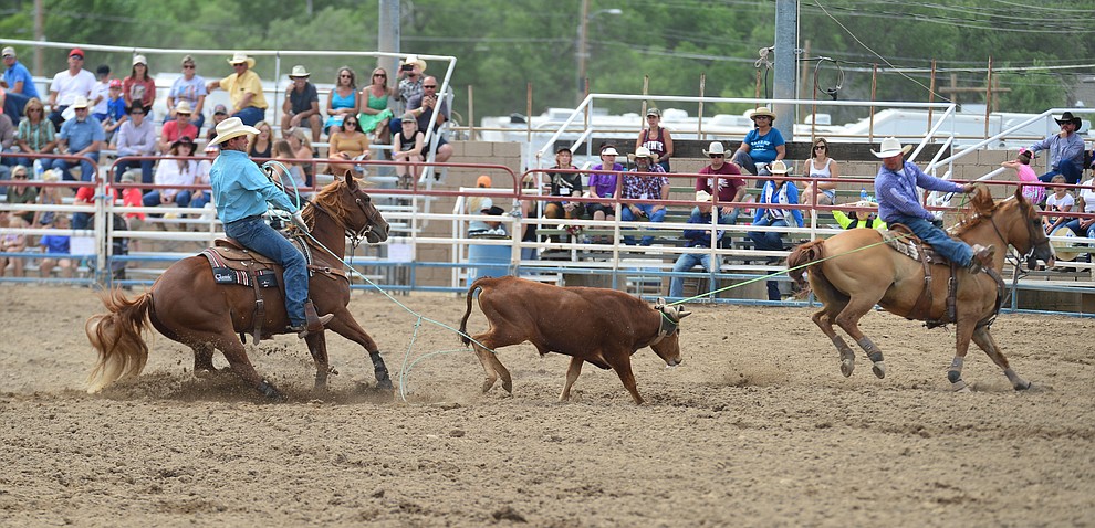 Luke Brown and Paul Eaves have a 5.5 second run in the team roping during the final performance of the Prescott Frontier Days Rodeo Sunday July 7, 2019. (Les Stukenberg/Courier)