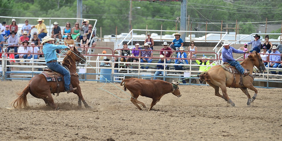Luke Brown and Paul Eaves have a 5.5 second run in the team roping during the final performance of the Prescott Frontier Days Rodeo Sunday July 7, 2019. (Les Stukenberg/Courier)