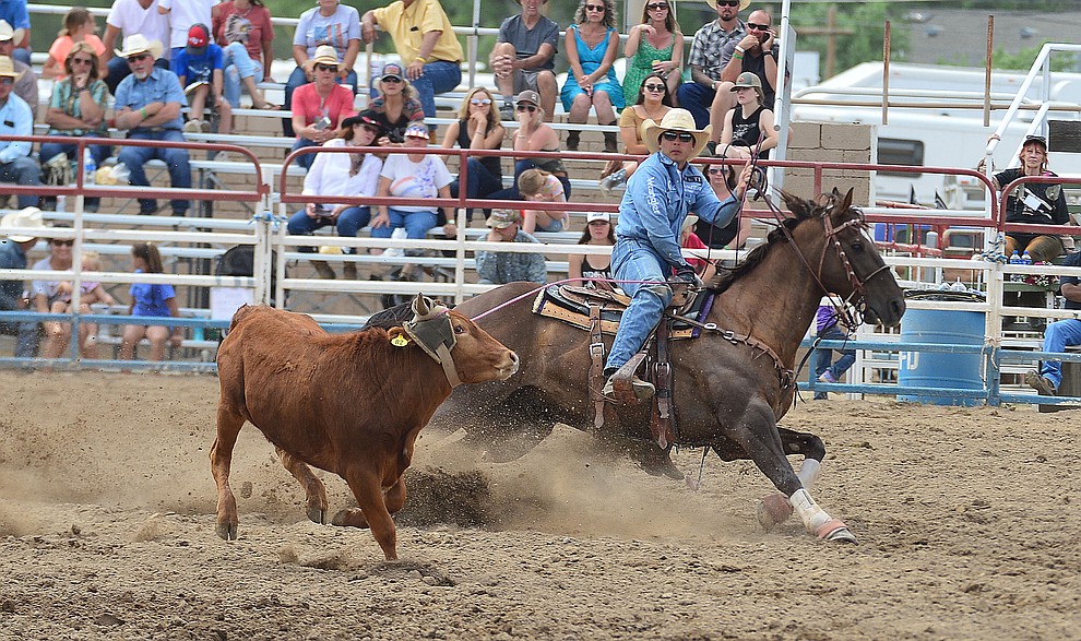 Tanner Green heading in the team roping during the final performance of the Prescott Frontier Days Rodeo Sunday July 7, 2019. (Les Stukenberg/Courier)