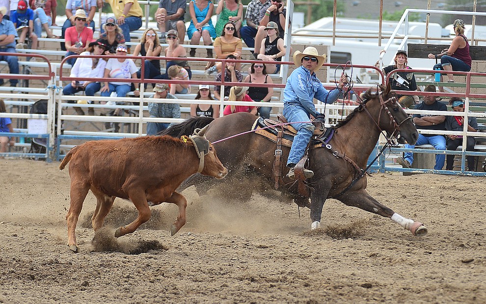 Tanner Green heading in the team roping during the final performance of the Prescott Frontier Days Rodeo Sunday July 7, 2019. (Les Stukenberg/Courier)