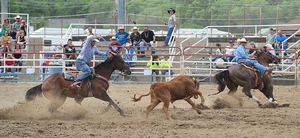 Tanner Green and Jake Clay in the team roping during the final performance of the Prescott Frontier Days Rodeo Sunday July 7, 2019. (Les Stukenberg/Courier)